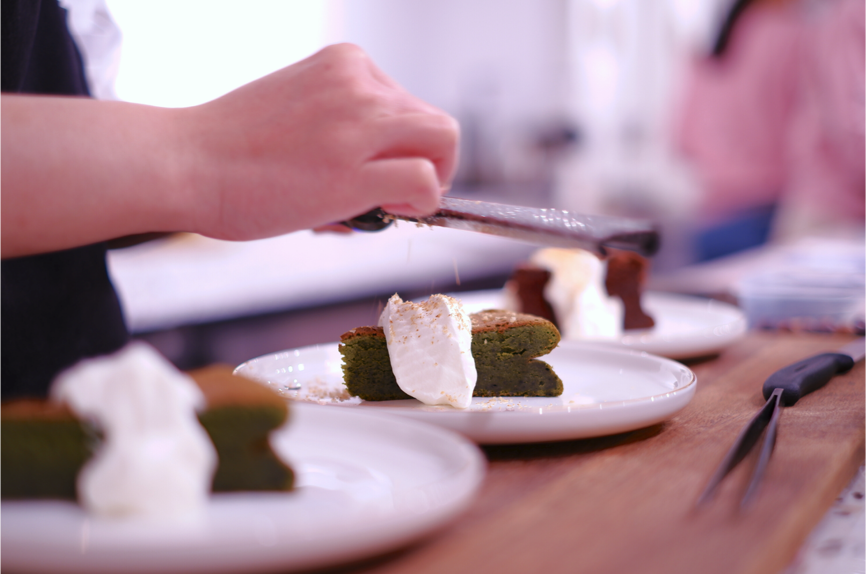 Close-up of plated cake being finished as part of a WSNXT food and lifestyle activation