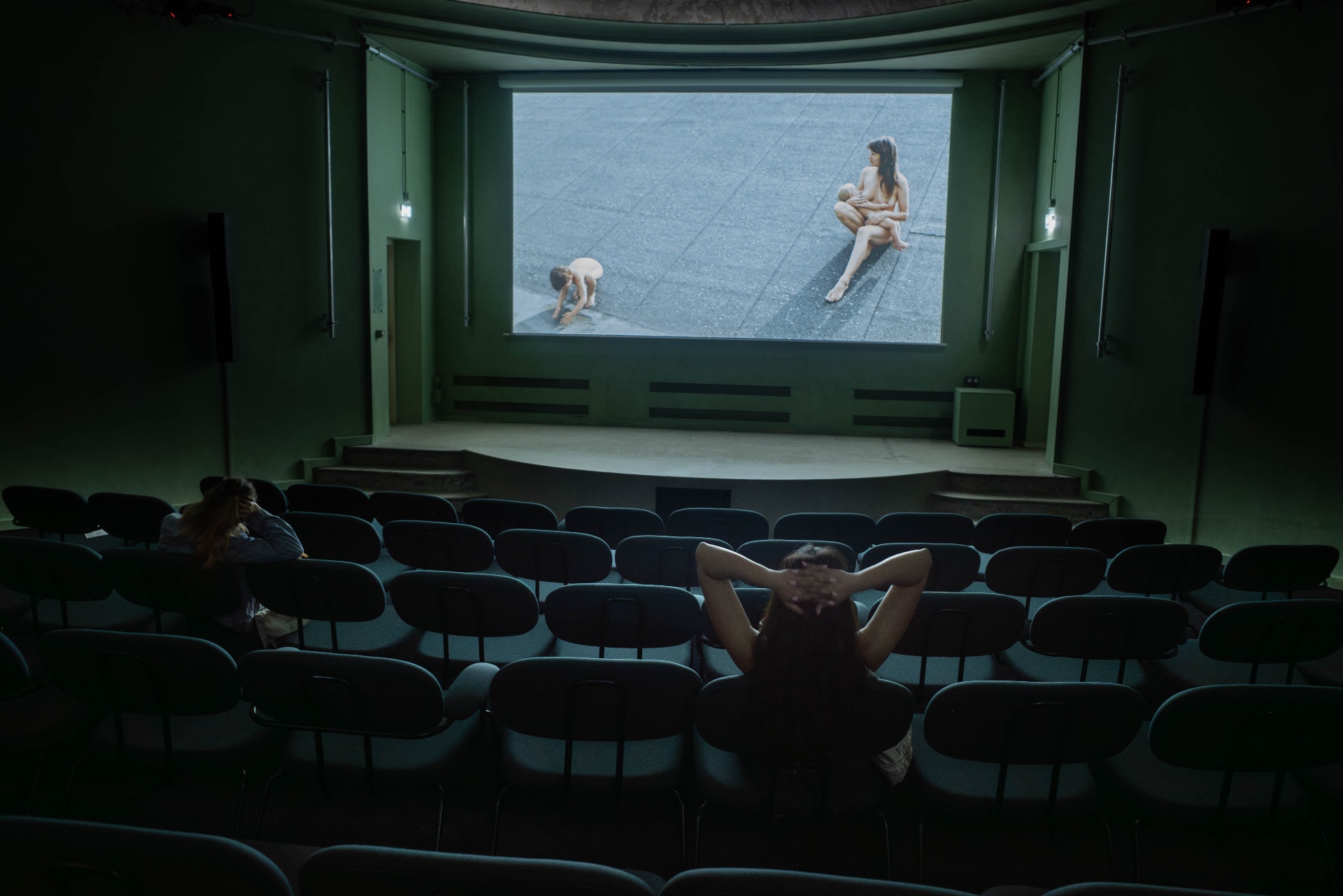 A near-empty cinema, a film on screen